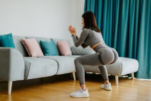 female butt workout squats at home. Fitness at home concept